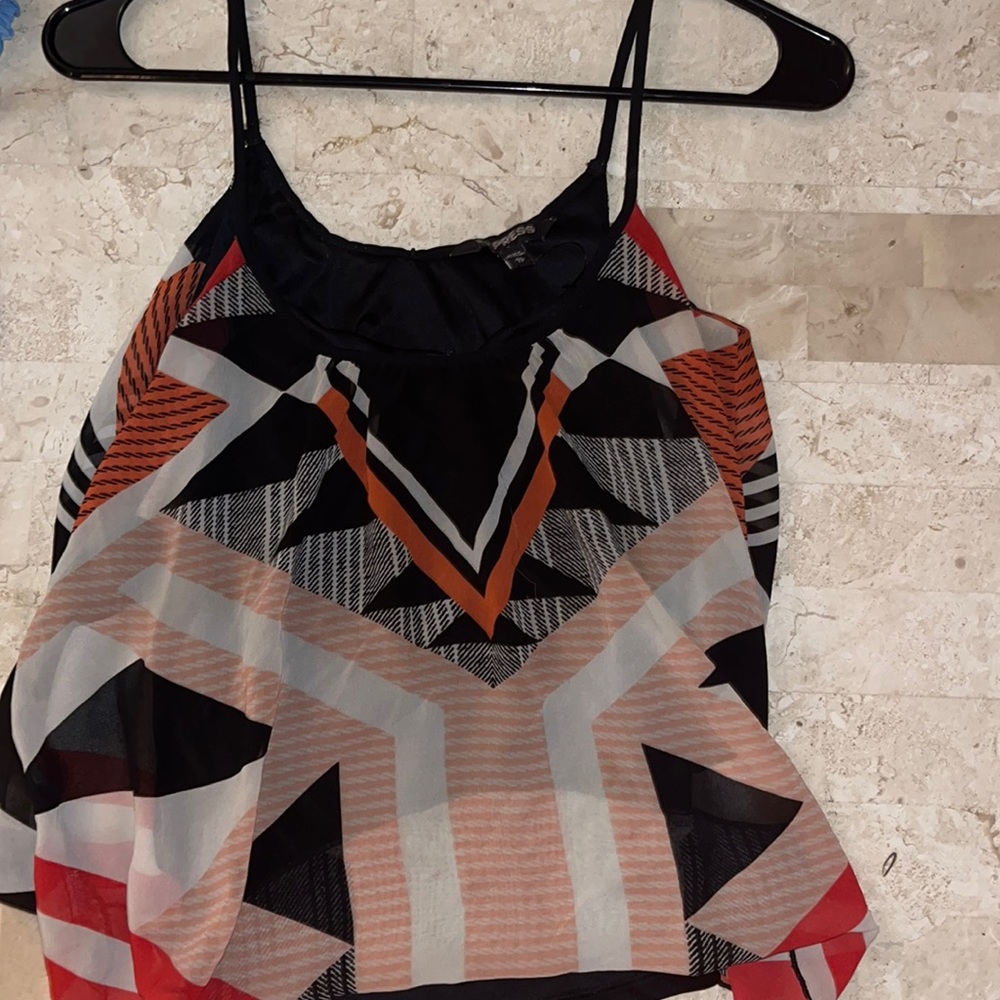 Express lined unique sleeveless top. Great for a night out.
